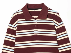 Detail of three-color striped polo shirt collar featuring burgundy, blue, and beige knit