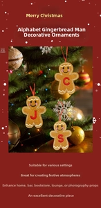 Detail of gingerbread man felt ornament with red letter embroidery on Christmas tree