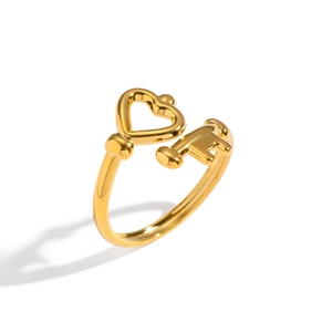 Golden stainless steel heart and key open ring with a polished metallic finish
