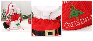 Detail of red knitted Christmas gift bag with Santa belt and snowman doll decoration
