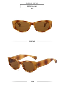 Detail view of tortoiseshell cat eye sunglasses with thick frames and brown lenses