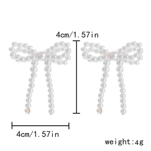 Detailed view of pearl bow earrings showing 4cm dimensions and lightweight 4g design