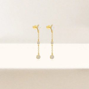 Macro detail of S925 silver long tassel earrings with geometric zircon pavé drop