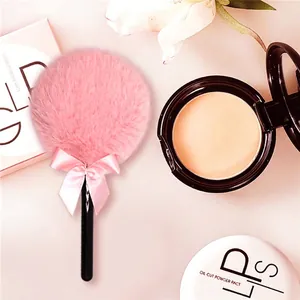 Pink fairy lollipop powder puff with soft plush texture and elegant satin bow handle