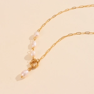 Detail of 18K gold-plated paperclip chain with baroque pearl pendant and spring clasp