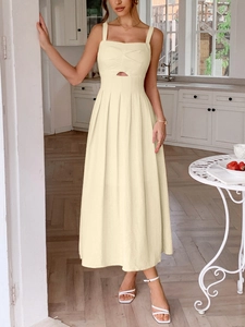 Close-up of beige spaghetti strap dress featuring pleated bust and hollow-out waist detail