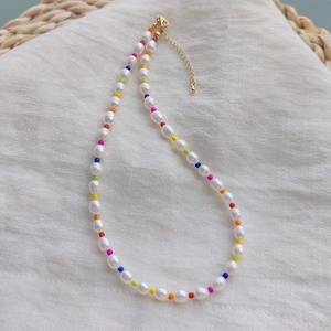 Natural freshwater pearl necklace with colorful seed beads and a gold lobster clasp