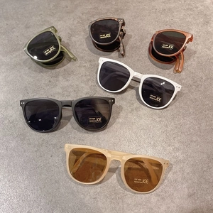 Flat lay of colorful foldable children's sunglasses with UV400 protection lenses