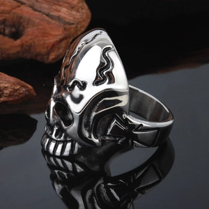 Detailed macro shot of gothic skull ring with cross engravings and vintage silver finish