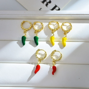 Colorful chili pepper earrings with gold braided hoops in red, yellow, and green colors