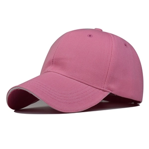 Close-up of pink baseball cap showing six-panel stitch detail and breathable eyelets