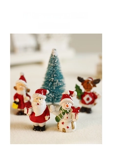 Miniature resin Christmas figurines featuring Santa and reindeer for festive decor