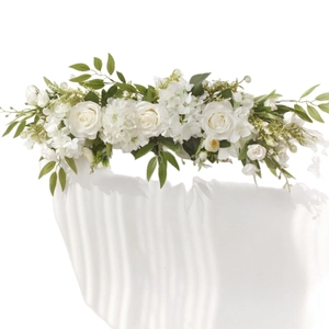 White artificial rose flower row with hydrangeas and green leaves for wedding decor