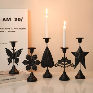 Five-piece black iron candle holder set with butterfly heart and star motifs for home decor