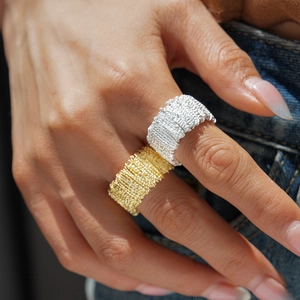 Set of gold and silver textured wide band rings with a unique crumpled metal design