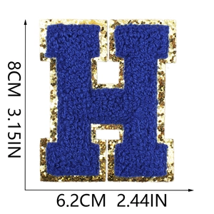 Detailed view of 8cm royal blue towel embroidery letter H patch with gold glitter borders