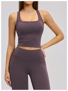 Detail view of square neck sports bra and high-waisted leggings in plum matte fabric