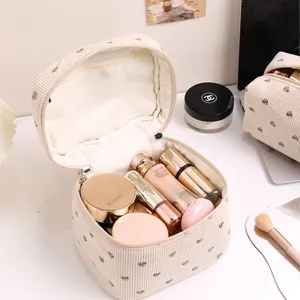 Chic cream corduroy cosmetic bag featuring black heart patterns and a large capacity design