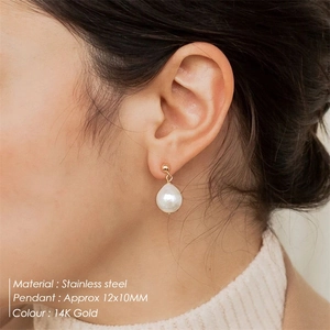 Elegant 14K gold plated stainless steel earrings with irregular freshwater pearls on model