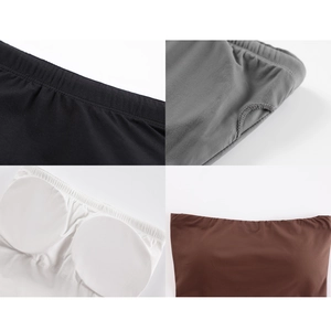 Detailed view of elastic fabric and removable circular breast pads in multiple colors