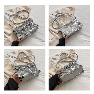 Detailed views of a silver sequin handbag with metallic chain strap and structured design