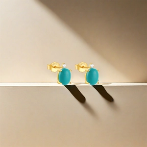 Detail of S925 silver flower moon stud earrings with turquoise stones and zircons