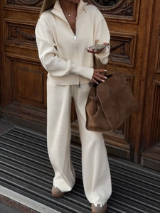 Elegant beige knitted two-piece set featuring a zip-up cardigan and wide-leg trousers for women