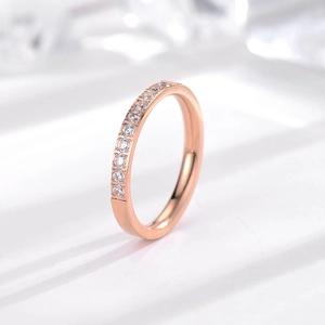 Macro view of rose gold titanium ring featuring ten micro-set stones in a row