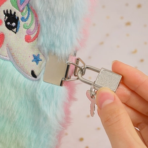 Close-up of fluffy unicorn notebook showing detailed metal padlock and key mechanism