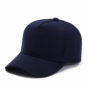 Detailed side view of navy blue five-panel baseball cap with premium twill fabric texture
