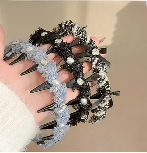 Detailed view of woven headbands with teeth and pearl accents for hair styling