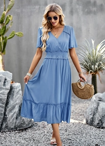 Detail view of the V-neck design and ruffled sleeves on this blue flowy maxi dress
