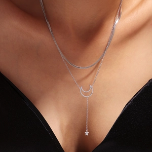 Elegant silver double-layer snake chain necklace with sparkling star and moon pendants