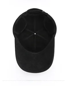 Detail view of the insulated inner lining and foldable ear flaps on this winter wool baseball cap