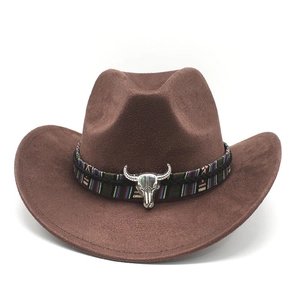 Detail of brown faux suede cowboy hat with colorful braided band and bull metal emblem