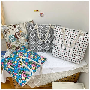 Selection of large floral and geometric canvas tote bags with thick rope handles