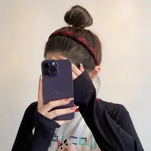 Classic red and black plaid headband detail showing the thick fabric and vintage style