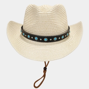 Detail of straw cowboy hat featuring turquoise studs, leather band and adjustable chin strap