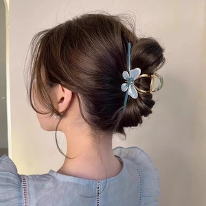 Elegant light blue butterfly hair claw clip with gold metal frame for women hair styling