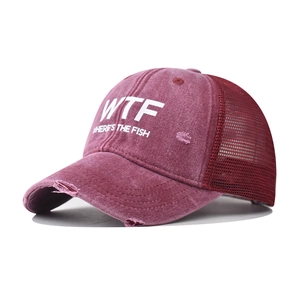 Distressed reddish-brown WTF baseball cap with breathable mesh back and vintage wash finish