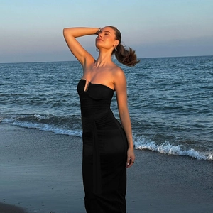 Elegant black strapless bodycon maxi dress with ruched detail for beach vacations