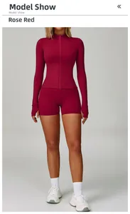 Slim fit rose red yoga set featuring long sleeve zip jacket and matching shorts on model