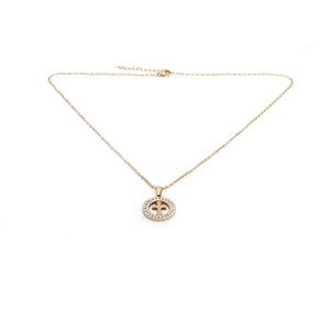 Close-up of golden stainless steel cross pendant necklace with sparkling crystal inlay