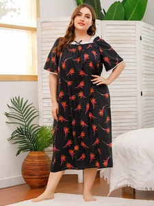 Detail of square neckline with white lace trim and floral print on plus size nightgown