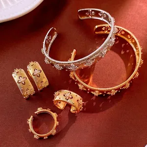Luxurious gold and silver plated jewelry set with flower zircon accents on velvet