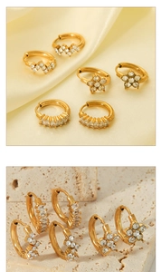 Detail of 18K gold plated stainless steel hoop earrings with flower and crystal designs