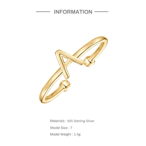 Macro detail of gold plated S925 sterling silver letter A initial open ring with specs