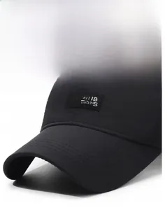 Detailed shot of a black baseball cap with 10.18 CAPS lion logo and reinforced brim