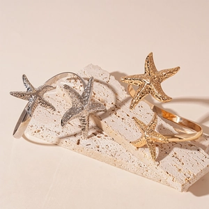 Irregular metallic starfish open arm cuff bracelet in gold and silver finish