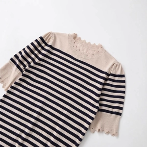Women's striped knit top with scalloped lace trim and puff sleeves in beige and navy